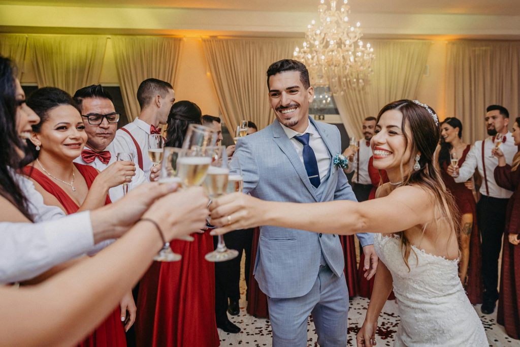 Funny wedding toast at a wedding. Guests smiling and happy