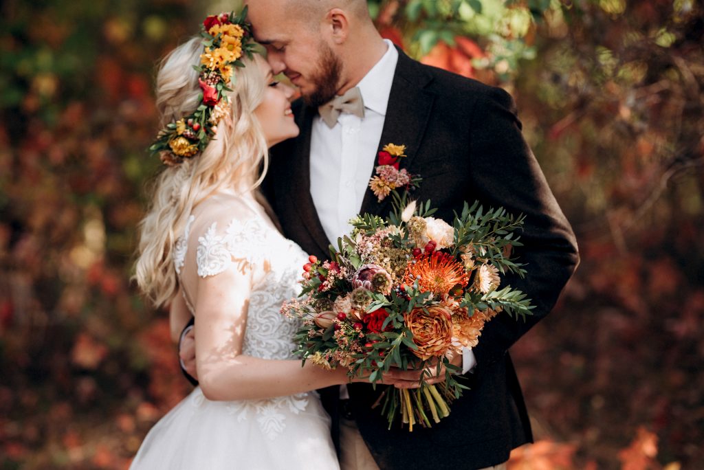 walk of the bride and groom through the autumn forest in October