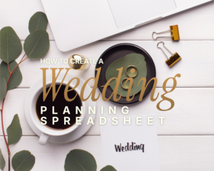 Wedding journal – open spiral planner with dried roses, wedding rings, and a pen on a white desk