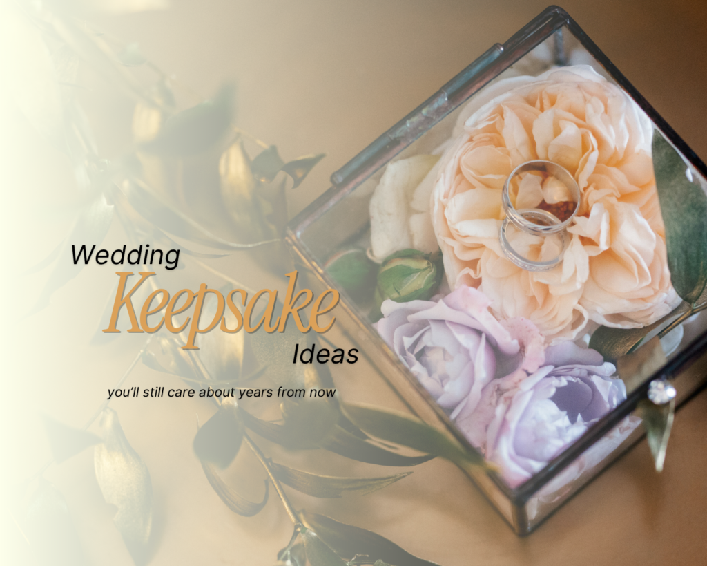 wedding-keepsake-ideas - wedding rings inside a glass box with peach and lavender roses and gold leaves